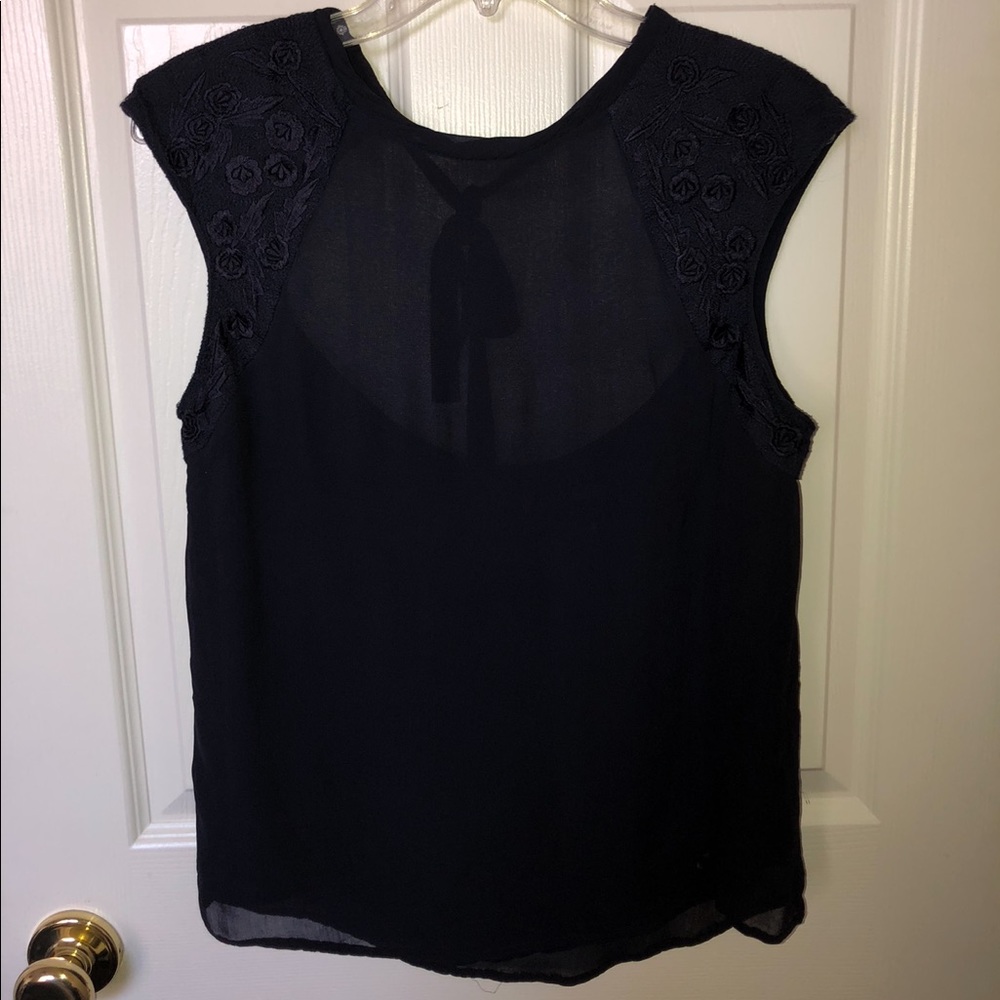 Blouse with deep back, and detail around arm